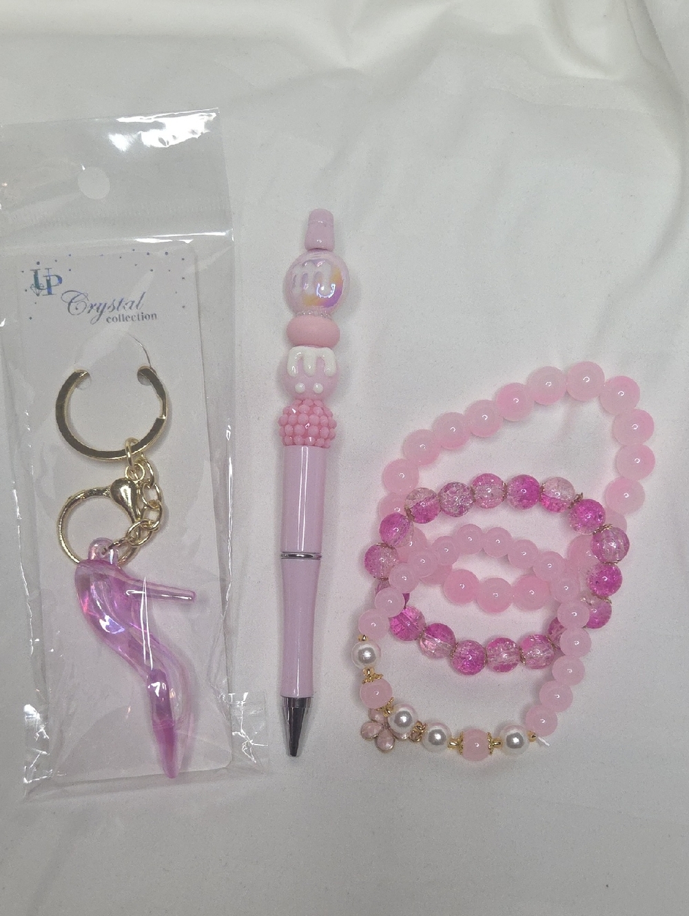 Pink Pen, 3 Glass Bead Bracelets and a Pink Heel Bag Charm
